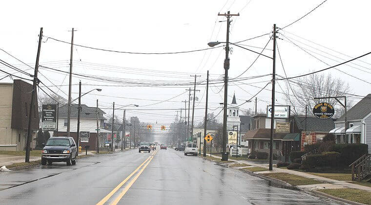 A street-view photograph of Bedford Township in Michigan taken on a rainy day. Bedford, Michigan is a location served by TAS Electronics.